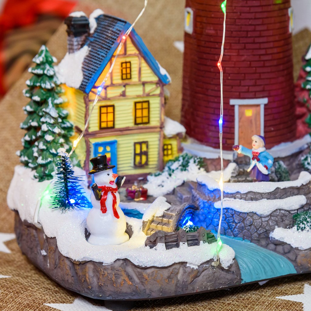 Villaggio di Natale in Poliresina – Faro con luce rotante – h 29 cm
