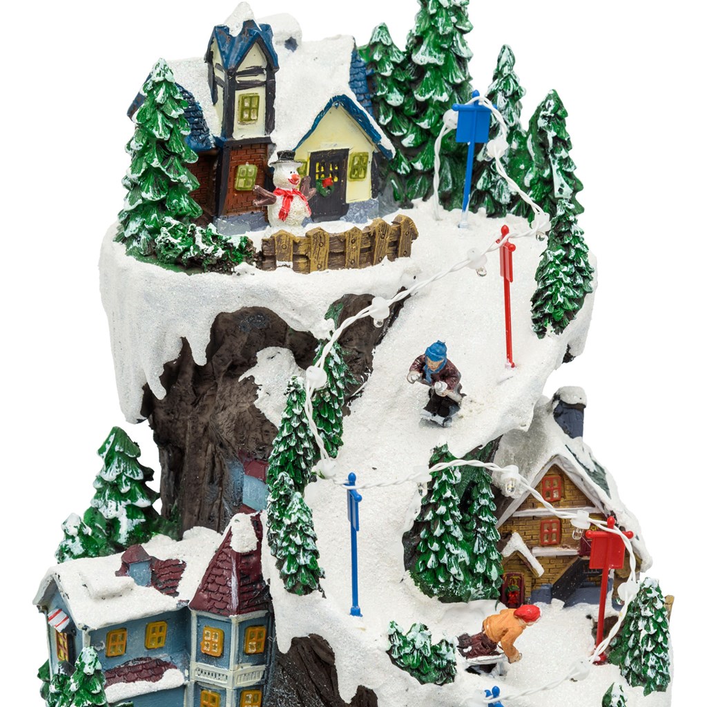 Villaggio Innevato con Sciatori – Trenino in Galleria in movimento in Polyresina – h 38 cm