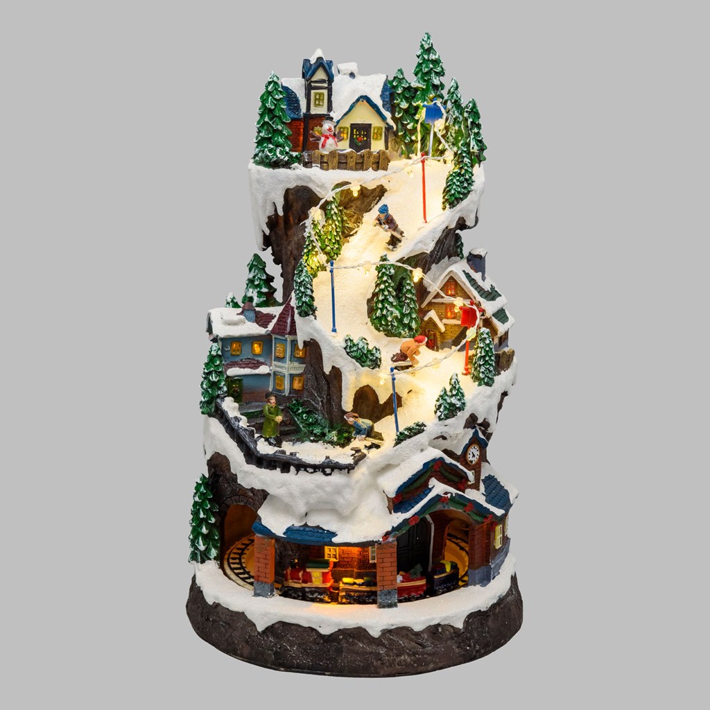 Villaggio Innevato con Sciatori – Trenino in Galleria in movimento in Polyresina – h 38 cm
