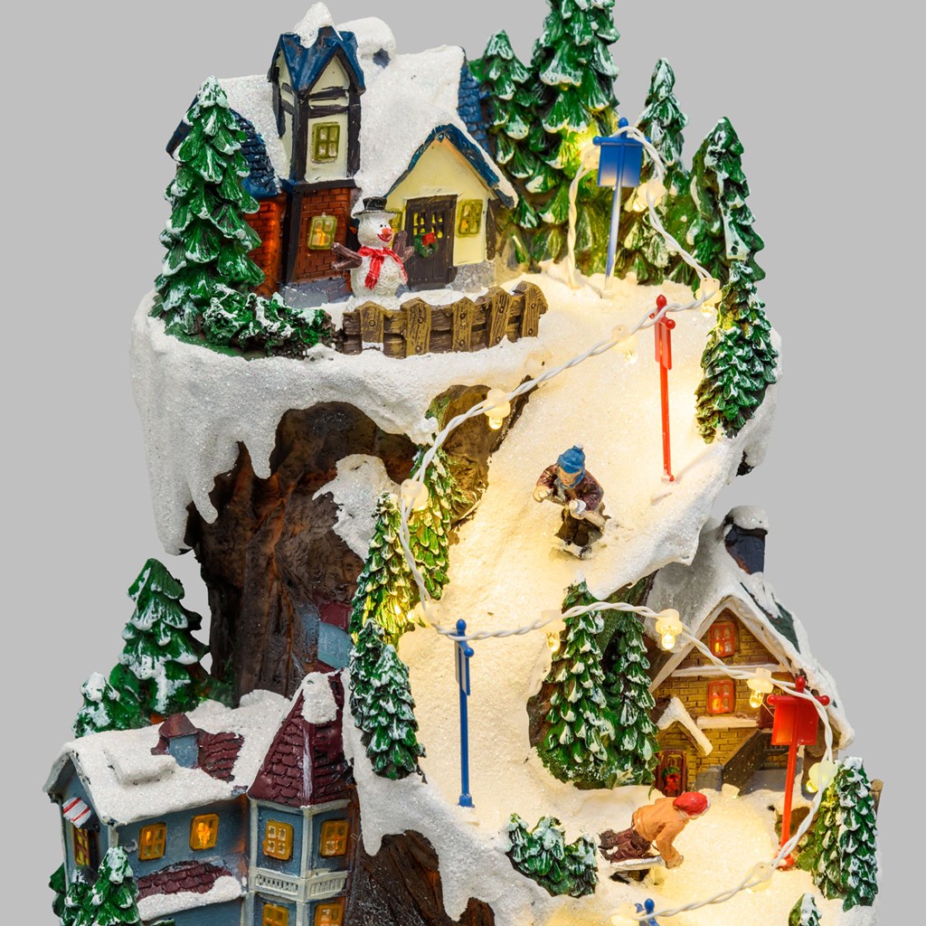 Villaggio Innevato con Sciatori – Trenino in Galleria in movimento in Polyresina – h 38 cm
